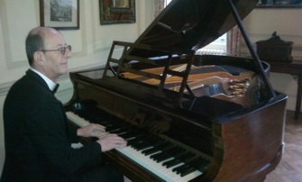 Brian on piano at Hedingham Castle
